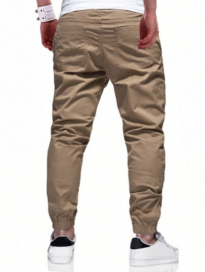 Manfinity Homme Pantalon carotte ample à taille élastique pour hommes, coupe ample, pantalon long uni kaki pour sortie, pour l'automne