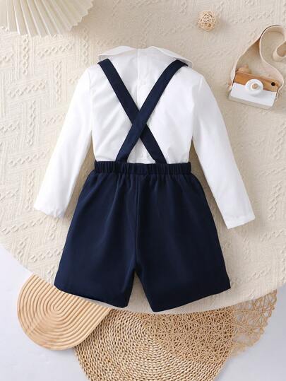 2 pièces Tenue décontractée d'écolier jeune garçon, chemise col mignon à motifs graphiques + short à bretelles réglables. Convient pour le quotidien, l'école, les vacances, les fêtes, les sports, printemps/été/automne/hiver. Épais en polaire, convient pou
