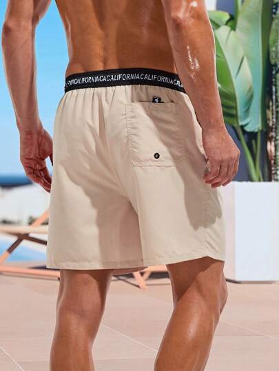 Manfinity KASUA Short de plage pour hommes avec imprimé de lettres et blocs de couleurs, taille élastique, vacances d'été, hawaïen, vacances