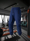 Pantalon de sport style petit ami avec taille à cordon, poches latérales et coupe ajustée pour hommes