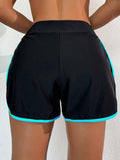 Swim Basics Short décontracté de sport en blocs de couleurs noir et blanc avec bordure, short de plage pour femmes
