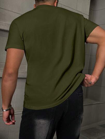 Manfinity Homme T-Shirt décontracté à manches courtes ample pour hommes avec inscription en relief, col rond pour l'été