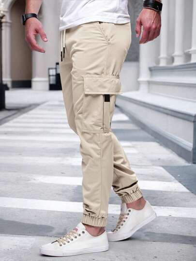 Manfinity Homme Pantalon cargo à taille élastique et cordon de serrage avec poches, jogging cargo, automne