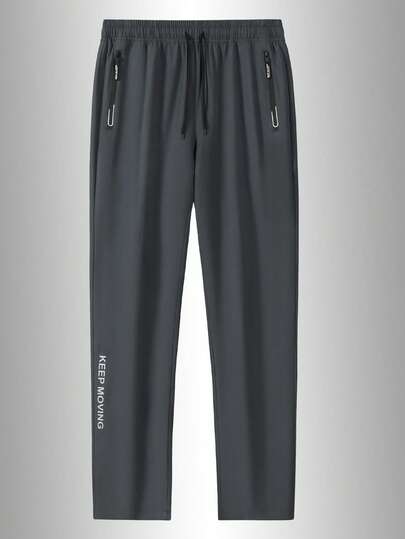 Pantalon long de sport d'extérieur pour hommes, imprimé latéral, poches zippées, design élastique, convient pour les voyages, la fitness, le port quotidien à la maison et en extérieur