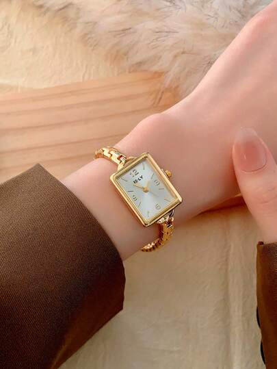 1 pièce Montre à quartz ovale dorée pour femmes, élégante & à la mode, convient pour le port quotidien, cadeau d'anniversaire/de remise de diplôme, rassemblements décontractés et fêtes