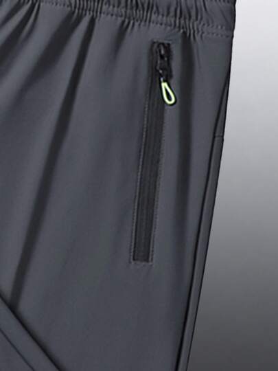 Pantalon de sport d'extérieur décontracté d'été pour hommes, tissu élastique frais et confortable, avec taille élastique à cordon de serrage et poches zippées sécurisées, convient pour un port quotidien