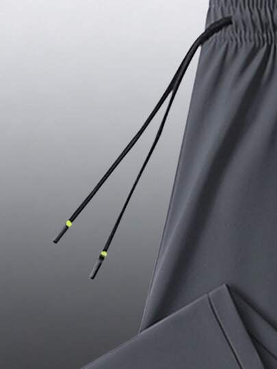 Pantalon de sport d'extérieur décontracté d'été pour hommes, tissu élastique frais et confortable, avec taille élastique à cordon de serrage et poches zippées sécurisées, convient pour un port quotidien