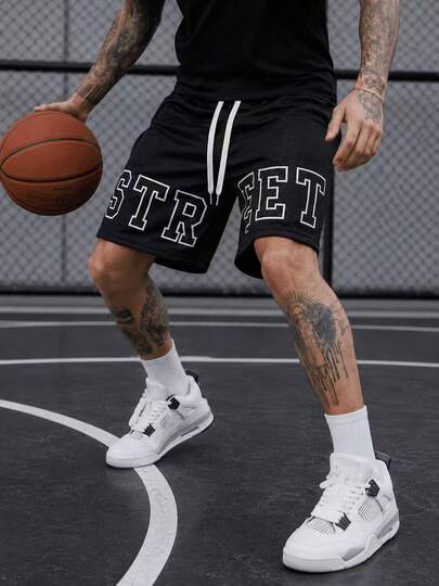 Shorts en maille noir à imprimé graphique audacieux pour hommes, shorts de basket-ball décontractés et amples, bas de streetwear à cordon de serrage pour sports d'été