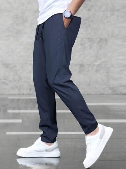 Manfinity Homme Pantalon décontracté pour hommes de couleur unie avec cordon de serrage à la taille et poches, polyvalent, automne