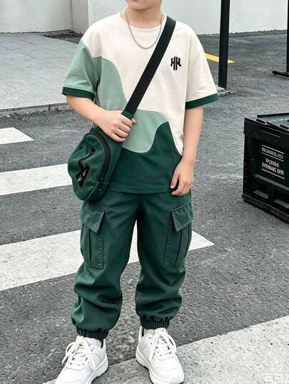 2 pièces Ensemble de tenue décontractée polyvalente pour garçons avec T-shirt à manches courtes imprimé éclaboussures et pantalon cargo fuselé, style élégant, convient pour les sorties, les vacances, les voyages, la photographie, nouvelle mode printemps/é