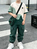 2 pièces Ensemble de tenue décontractée polyvalente pour garçons avec T-shirt à manches courtes imprimé éclaboussures et pantalon cargo fuselé, style élégant, convient pour les sorties, les vacances, les voyages, la photographie, nouvelle mode printemps/é