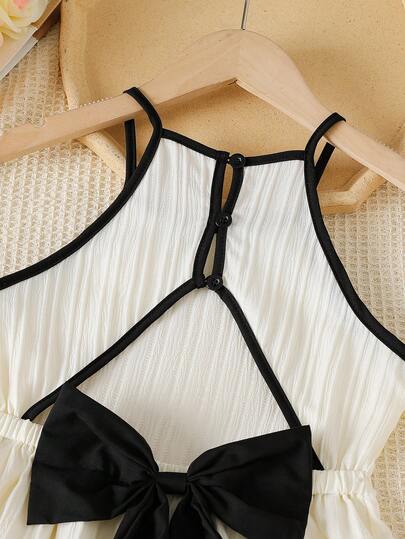 1 pièce Robe à bretelles spaghetti pour préadolescente, style vacances tropicales, décoration nœud, design ajouré, fabriquée en tissu doux et agréable à la peau, convient pour les vacances à la plage, la promenade sur la plage, les sorties d'été, les piqu