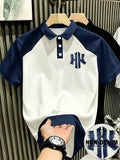 Manfinity Hypemode Polo à effet denim rétro américain, blocs de couleurs délavé avec imprimé lettre NY, Top décontracté pour hommes et femmes, convient pour les trajets quotidiens et les loisirs d'été