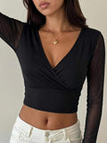 Blouse courte à col croisé, manches en tulle transparent, haut polyvalent très extensible pour les fêtes et le quotidien